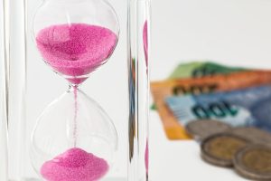 angel investor sand clock and money